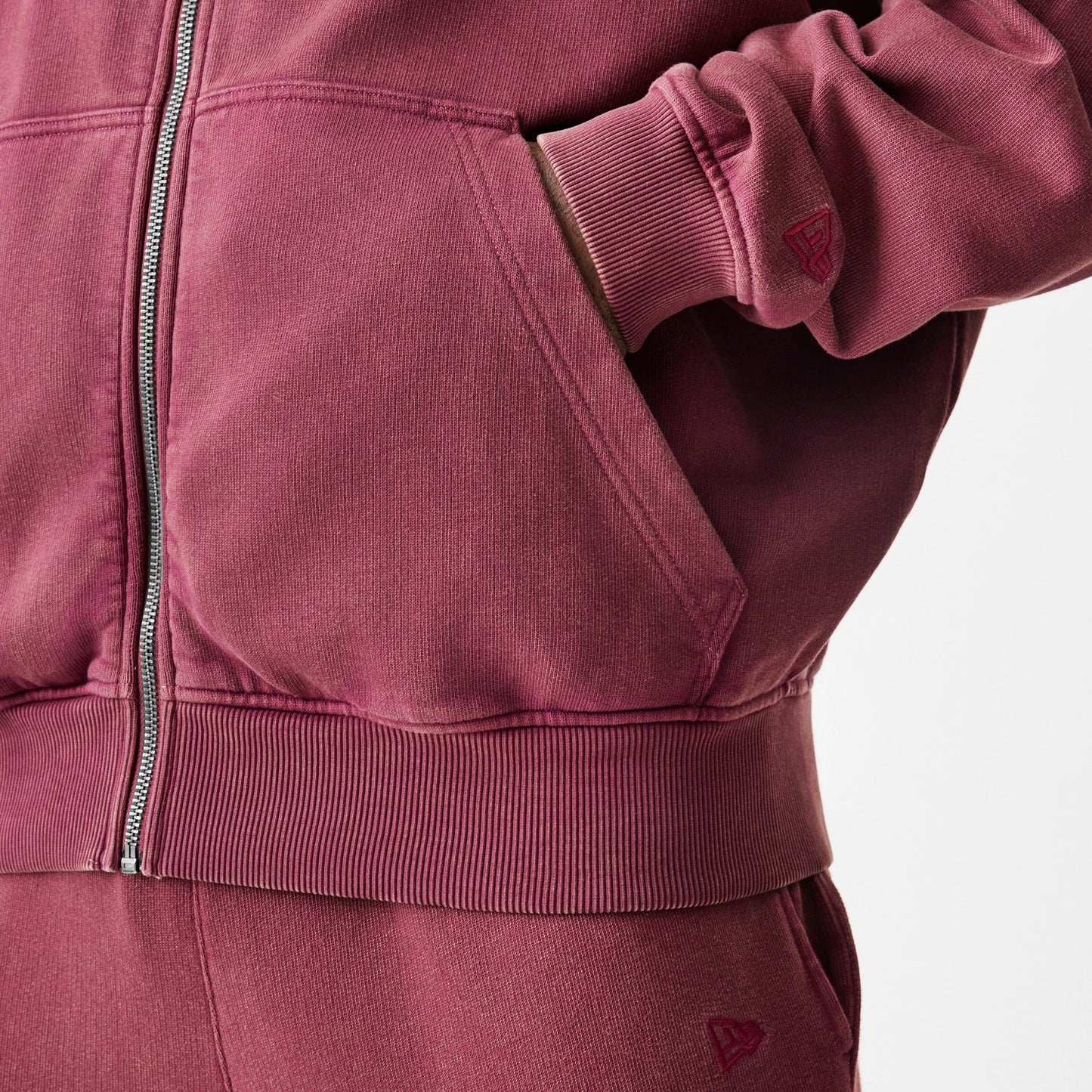 The Male model is wearing  New Era Washed Dark Red Oversized Full Zip Hoodie 7