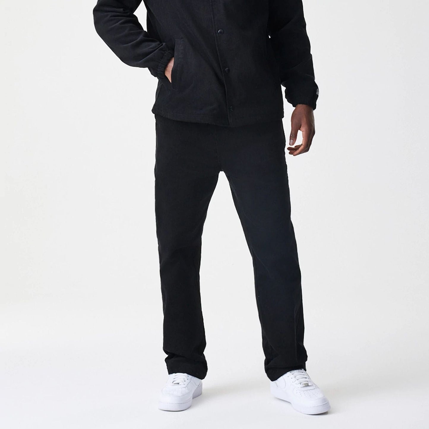 The Male model is wearing  New Era Cord Black Straight Leg Chinos 7