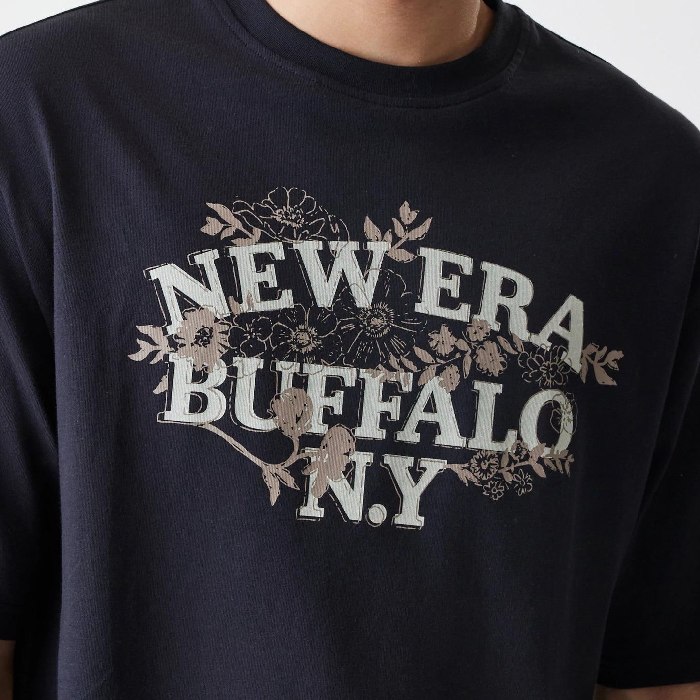 The Male model is wearing  New Era Floral Black Oversized T-Shirt 4