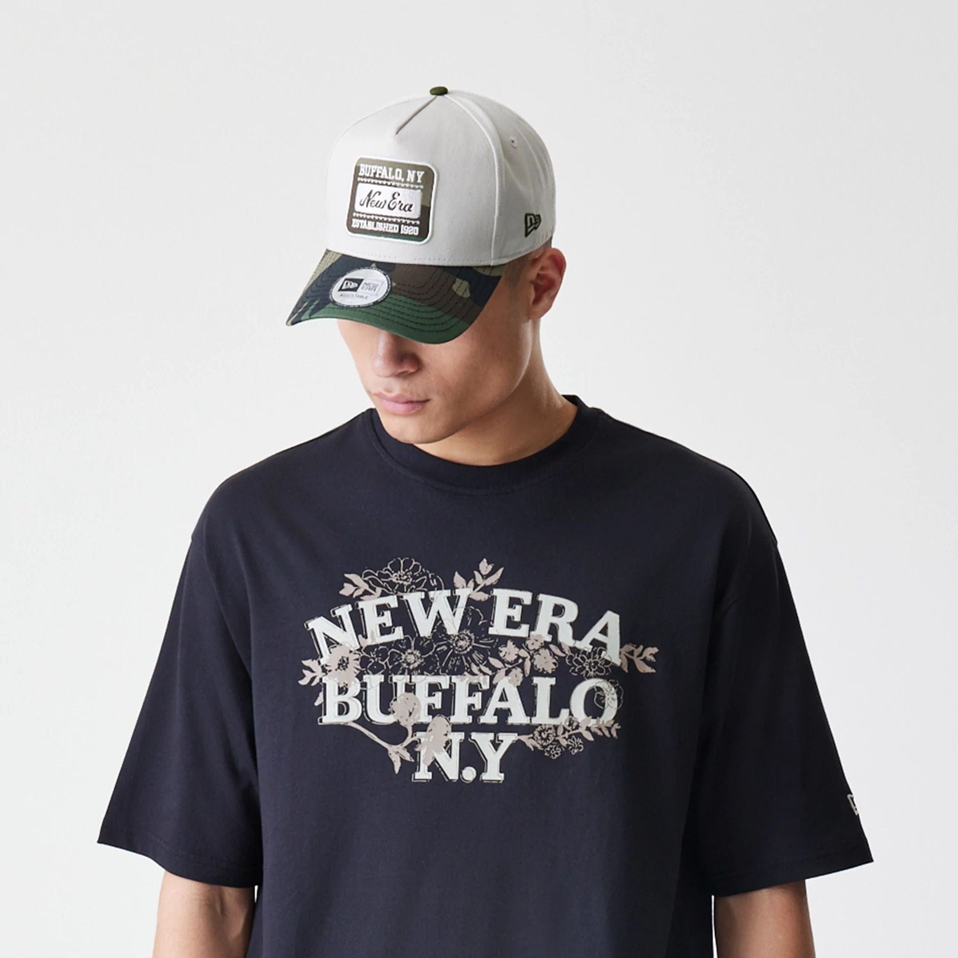 The Male model is wearing  New Era Floral Black Oversized T-Shirt  6