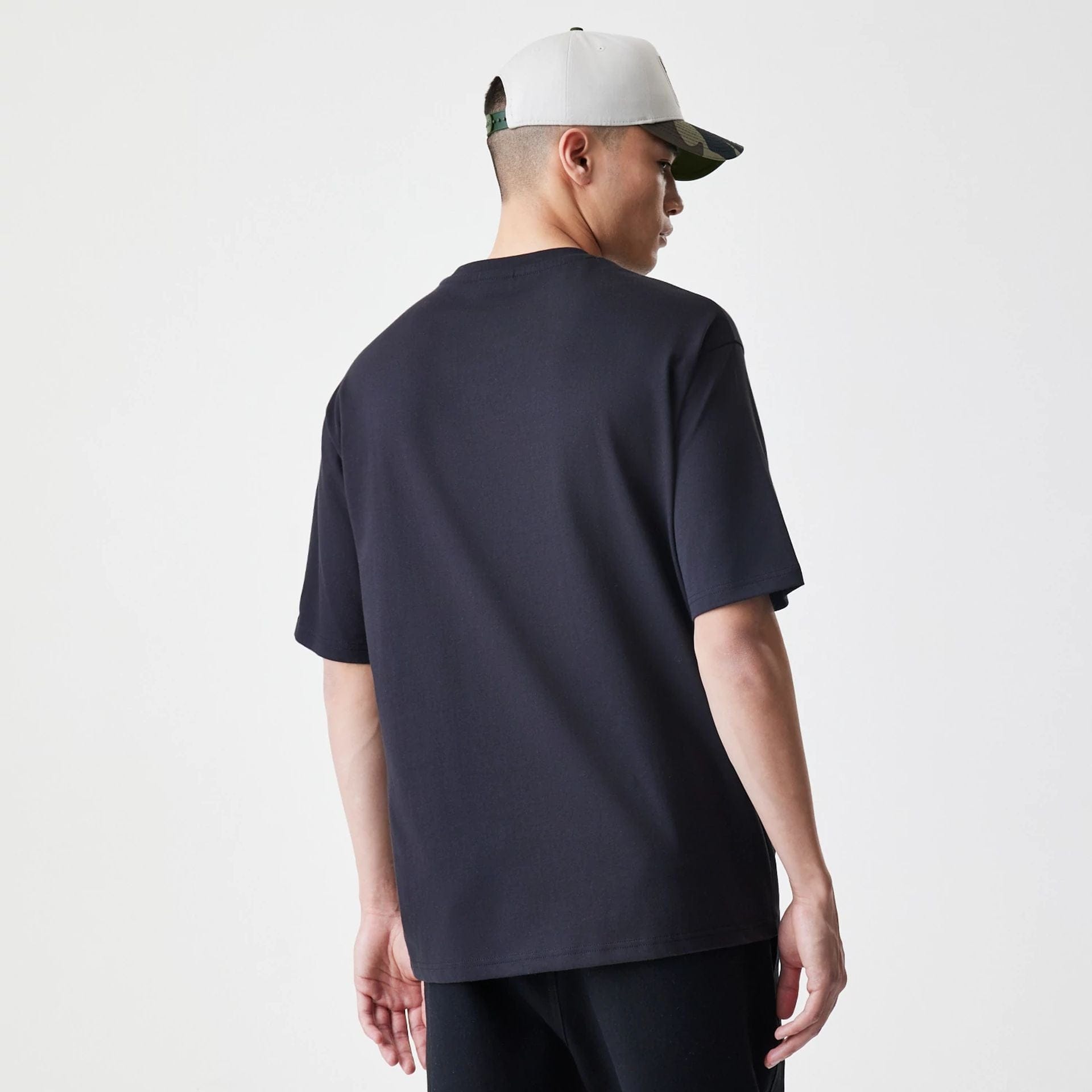 The Male model is wearing  New Era Floral Black Oversized T-Shirt  2