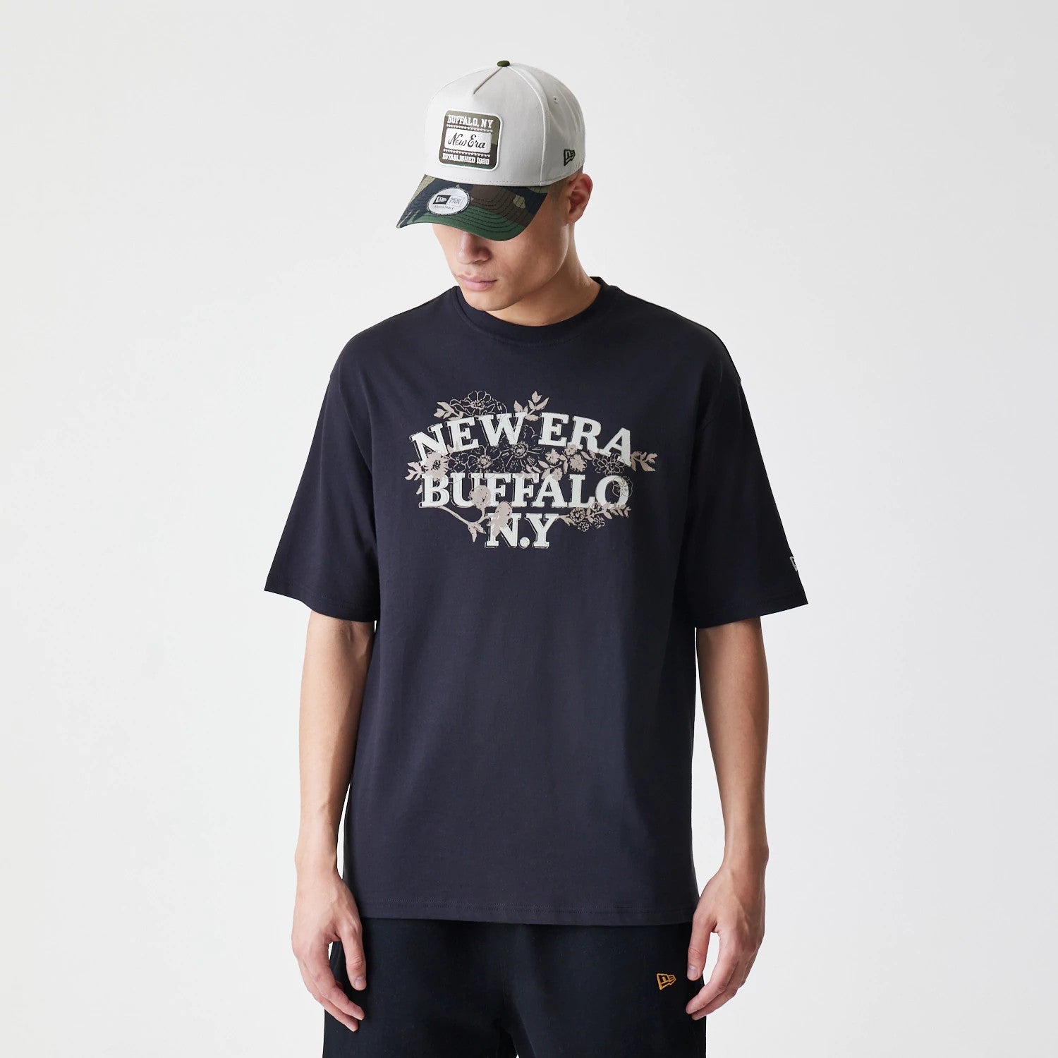 The Male model is wearing  New Era Floral Black Oversized T-Shirt 1