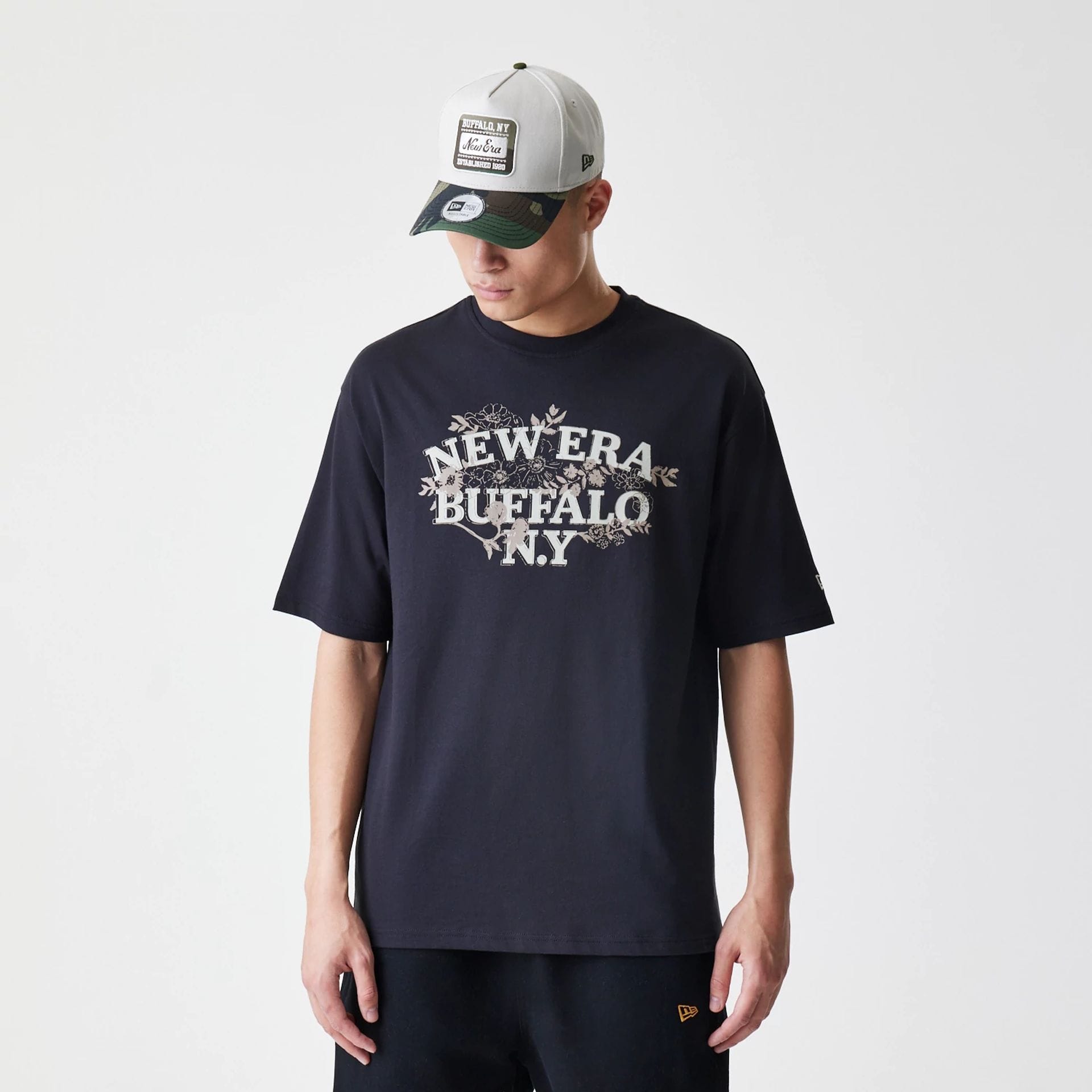 The Male model is wearing  New Era Floral Black Oversized T-Shirt 1