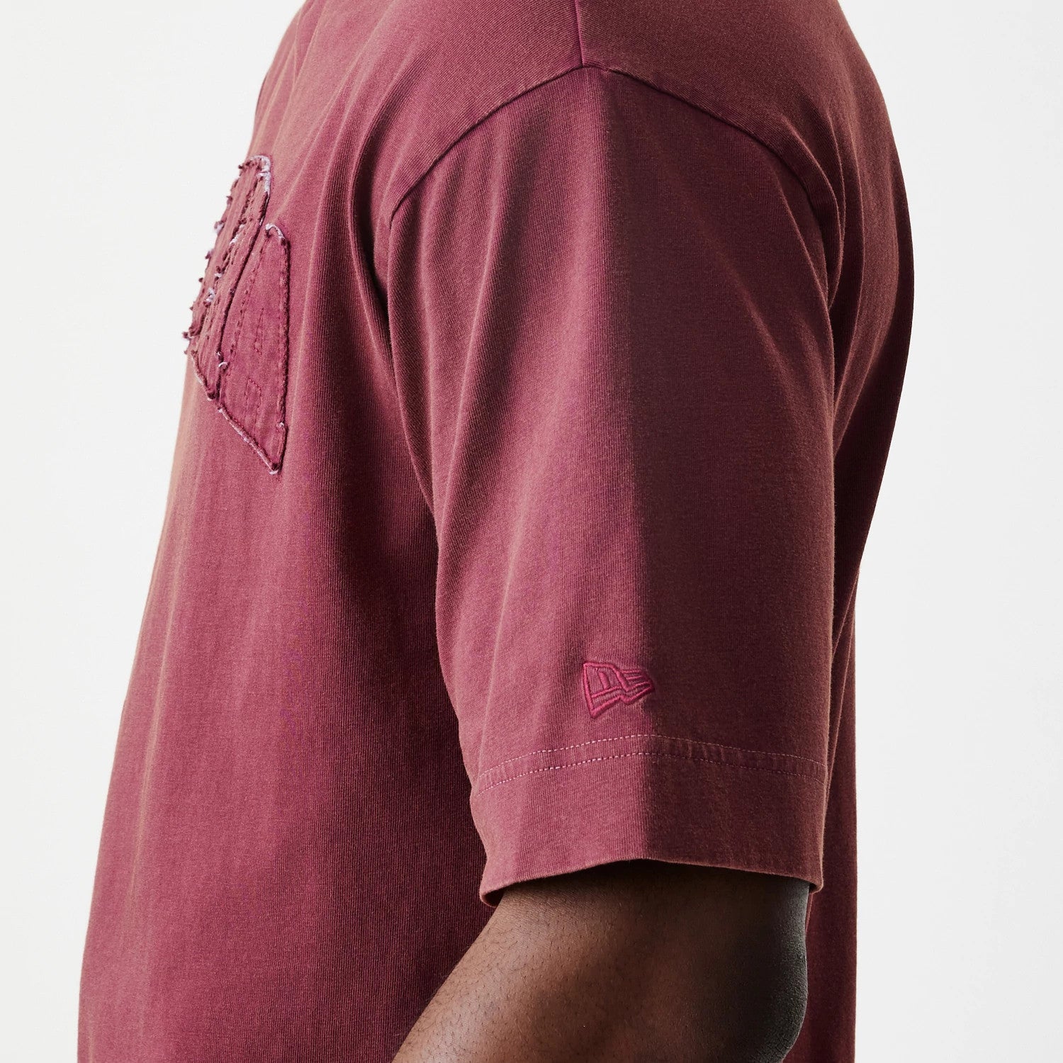 The Male model is wearing  New Era Washed Dark Red Oversized T-Shirt 7