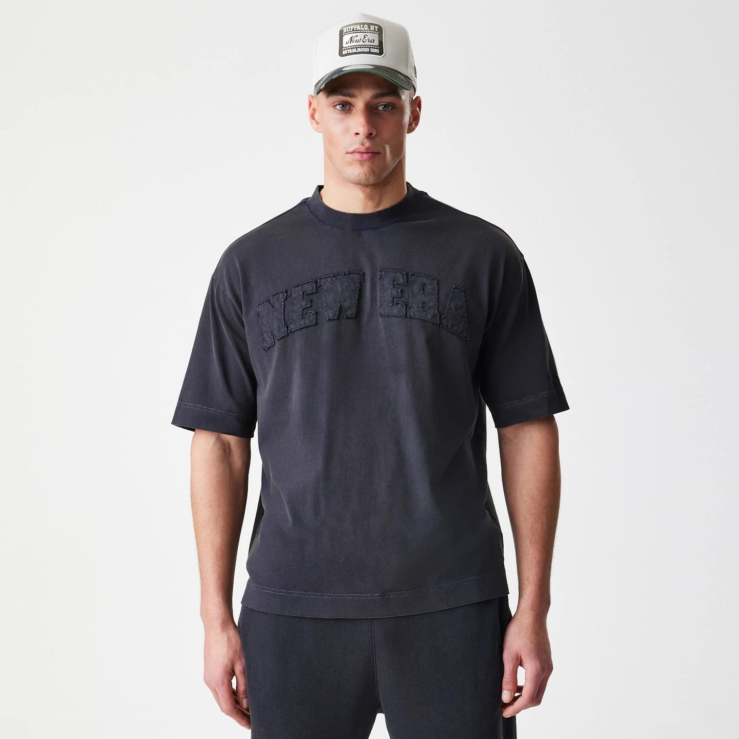 The Male model is wearing  New Era Washed Black Oversized T-Shirt 3
