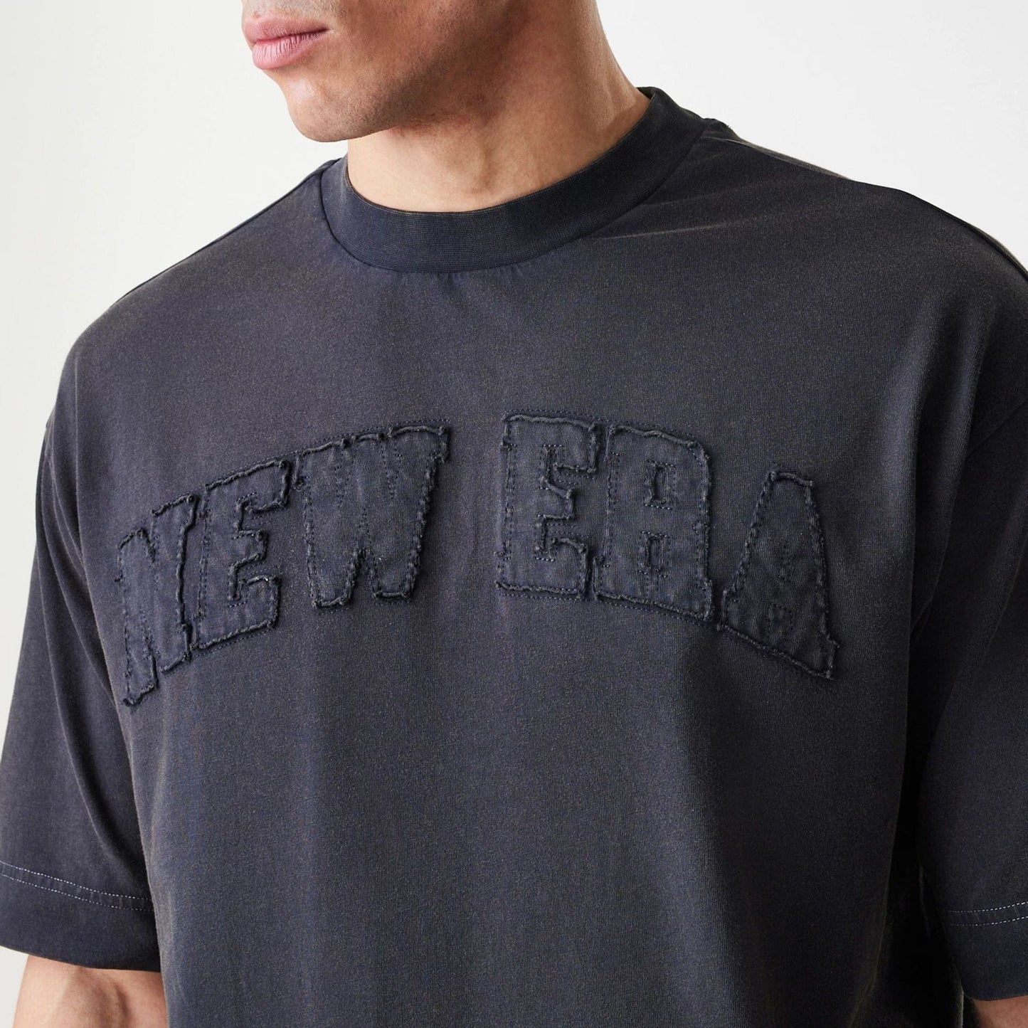 The Male model is wearing  New Era Washed Black Oversized T-Shirt  5