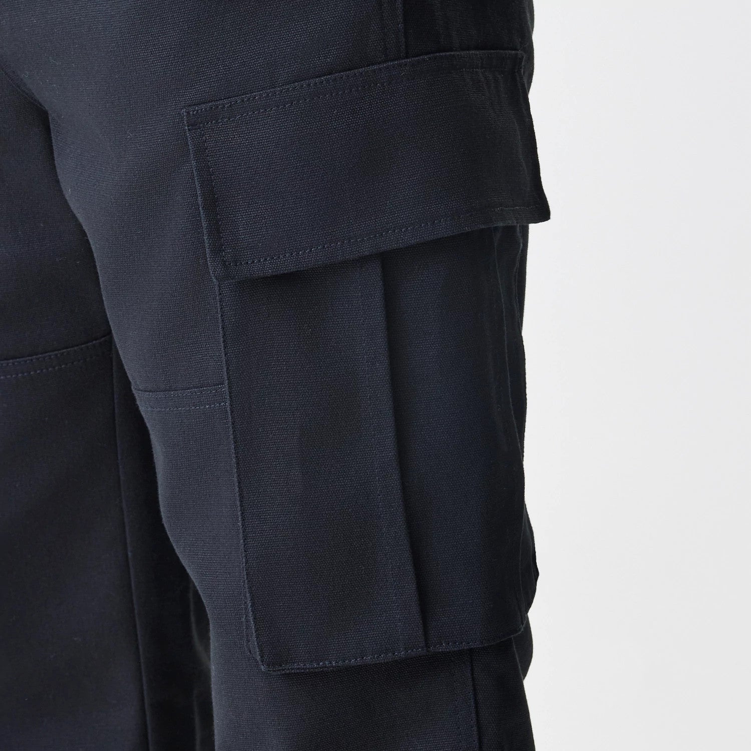 The Male model is wearing  New Era Cargo Black Straight Leg Trousers 4