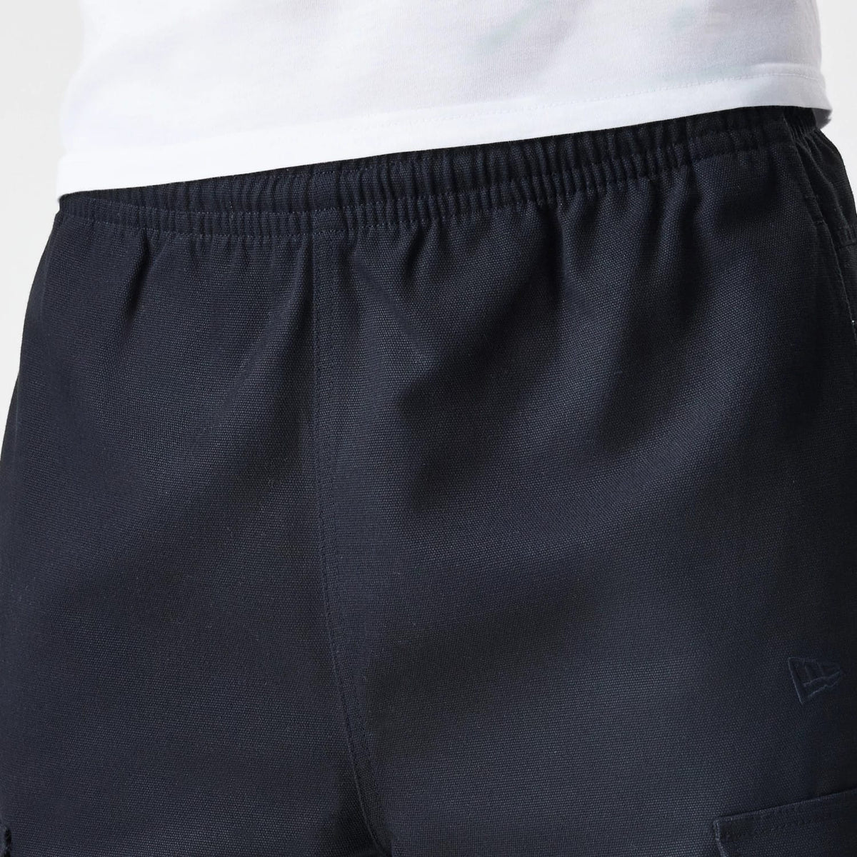 The Male model is wearing  New Era Cargo Black Straight Leg Trousers 6