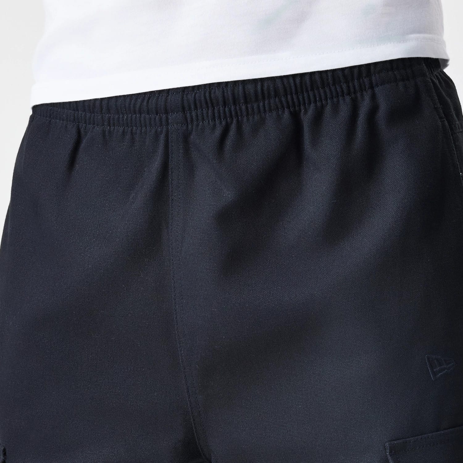 The Male model is wearing  New Era Cargo Black Straight Leg Trousers 6
