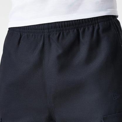 The Male model is wearing  New Era Cargo Black Straight Leg Trousers 6