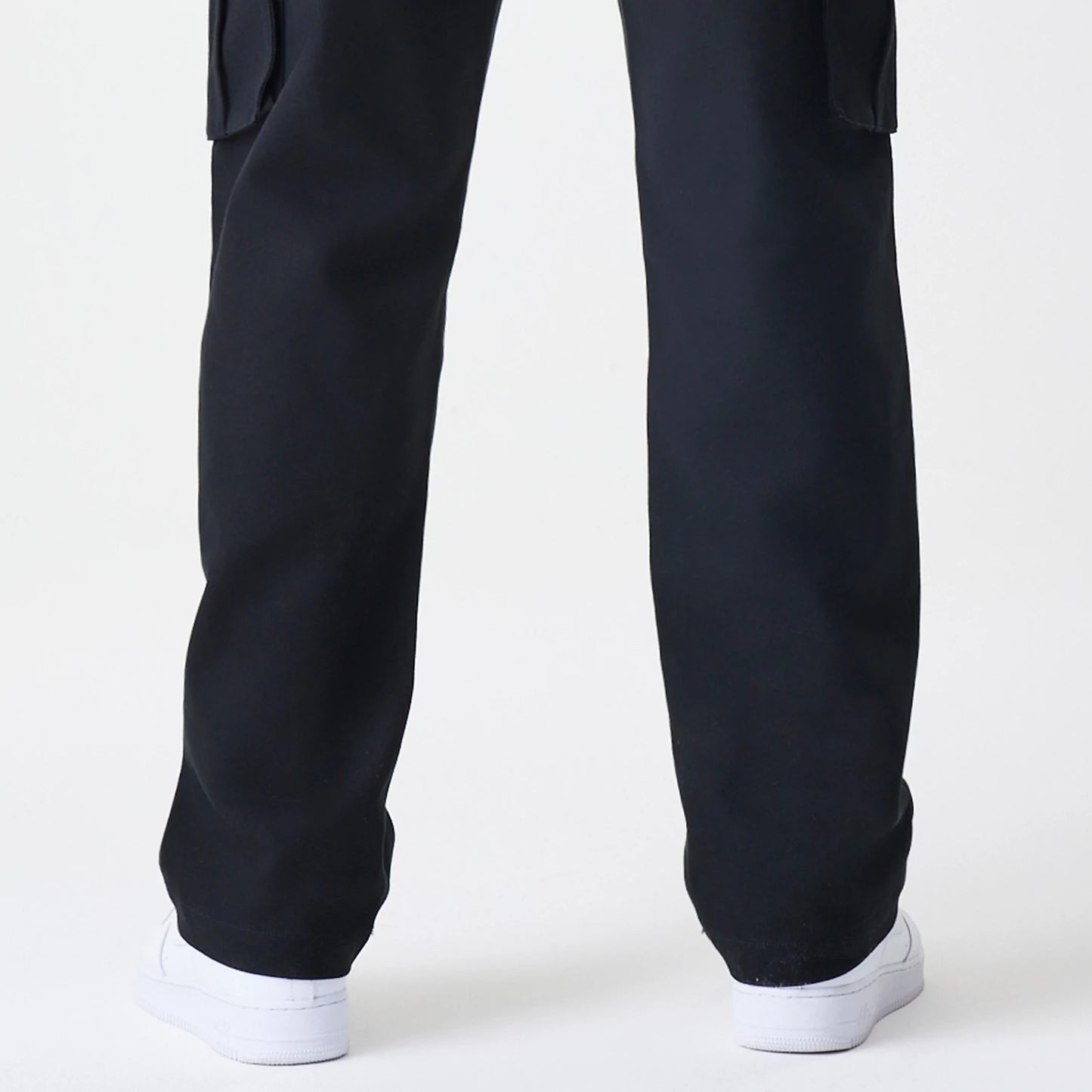The Male model is wearing  New Era Cargo Black Straight Leg Trousers 7