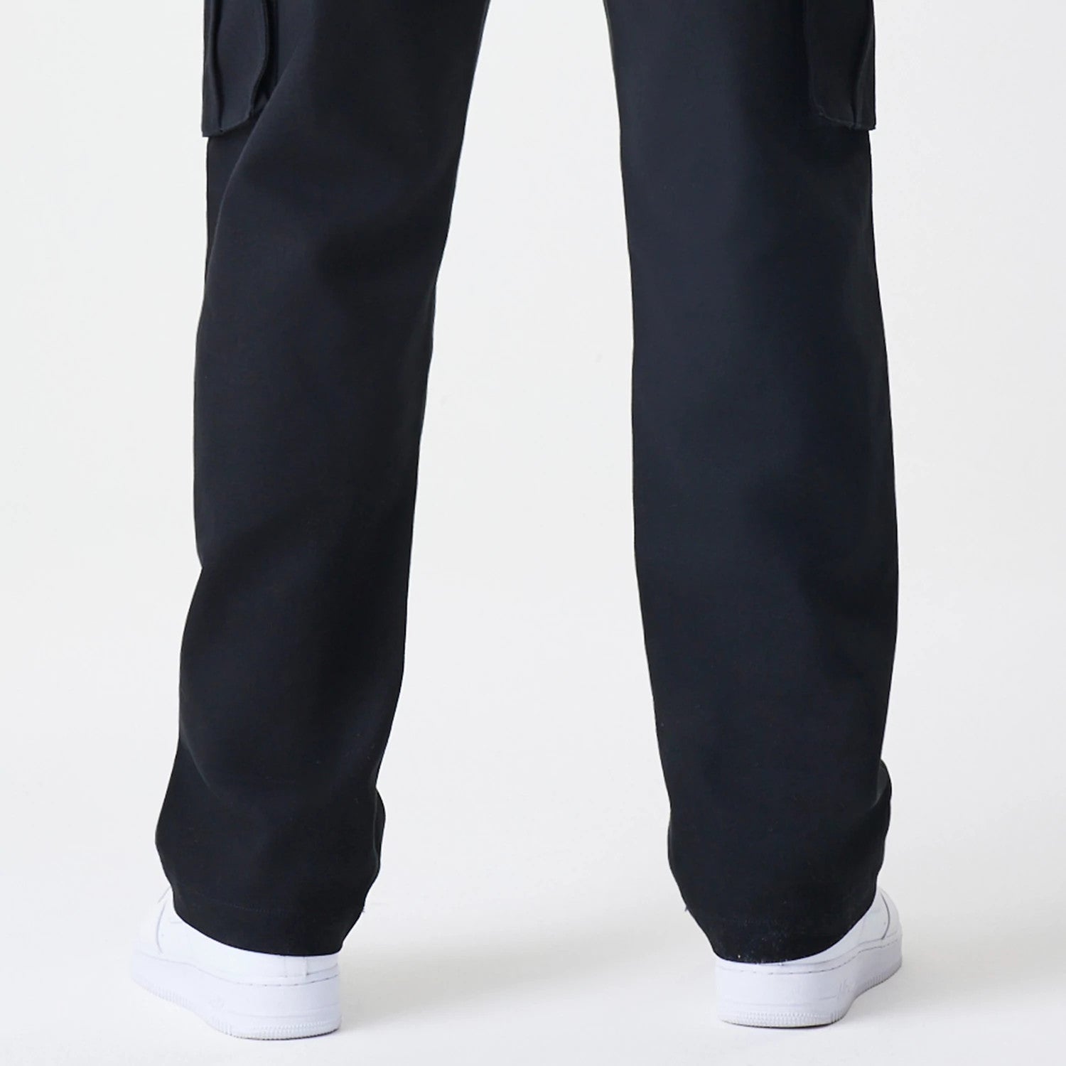 The Male model is wearing  New Era Cargo Black Straight Leg Trousers 7