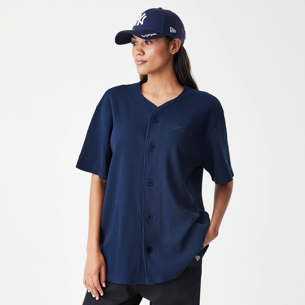 The Male model is wearing  New Era Waffle Navy Jersey 4
