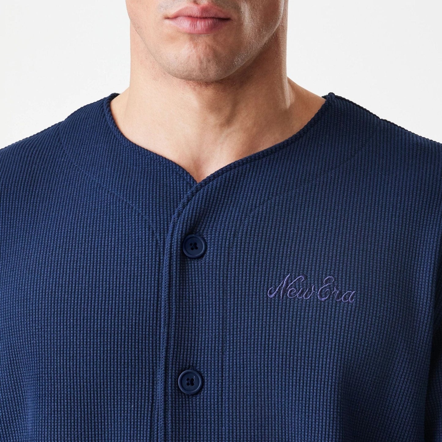 The Male model is wearing  New Era Waffle Navy Jersey  5