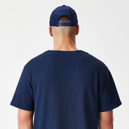 The Male model is wearing  New Era Waffle Navy Jersey 8