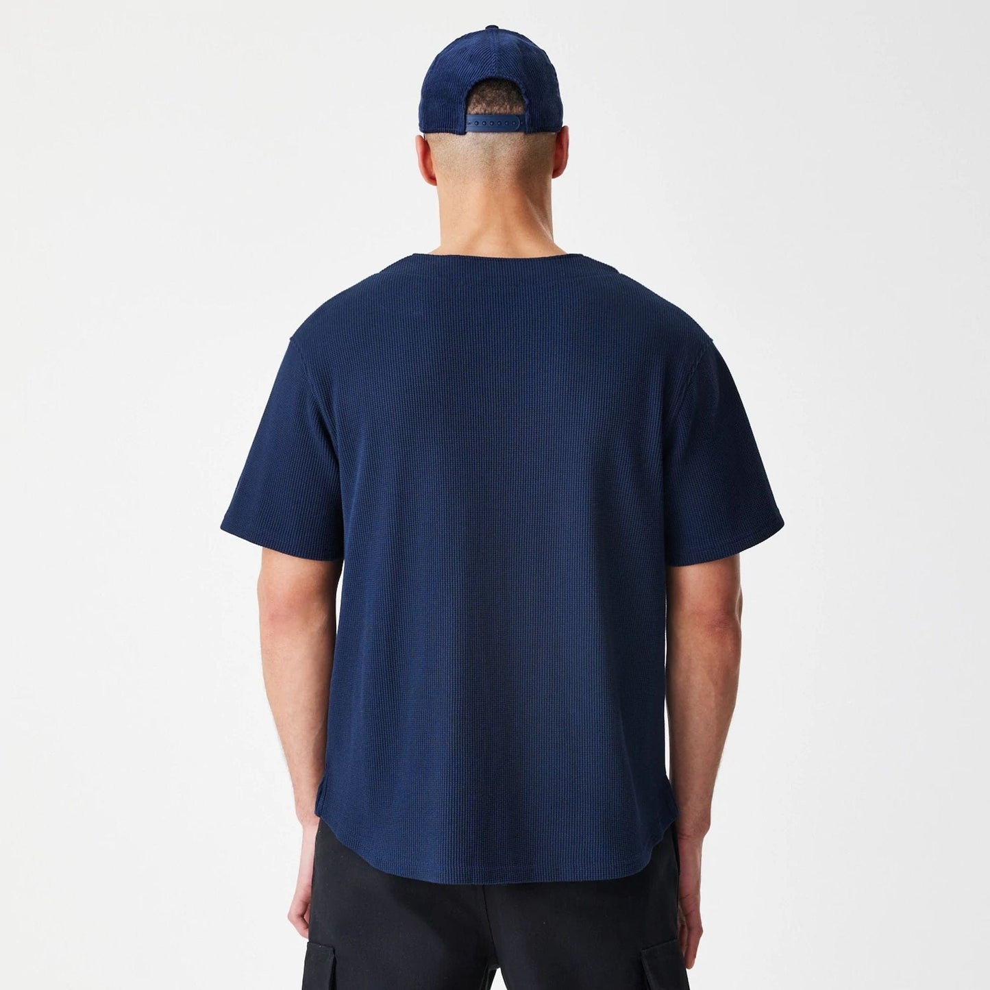 The Male model is wearing  New Era Waffle Navy Jersey  2