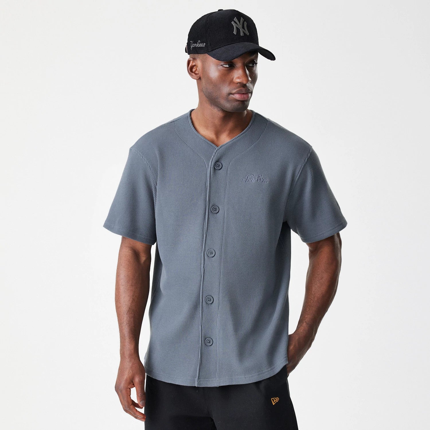 The Male model is wearing  New Era Waffle Dark Grey Jersey 3