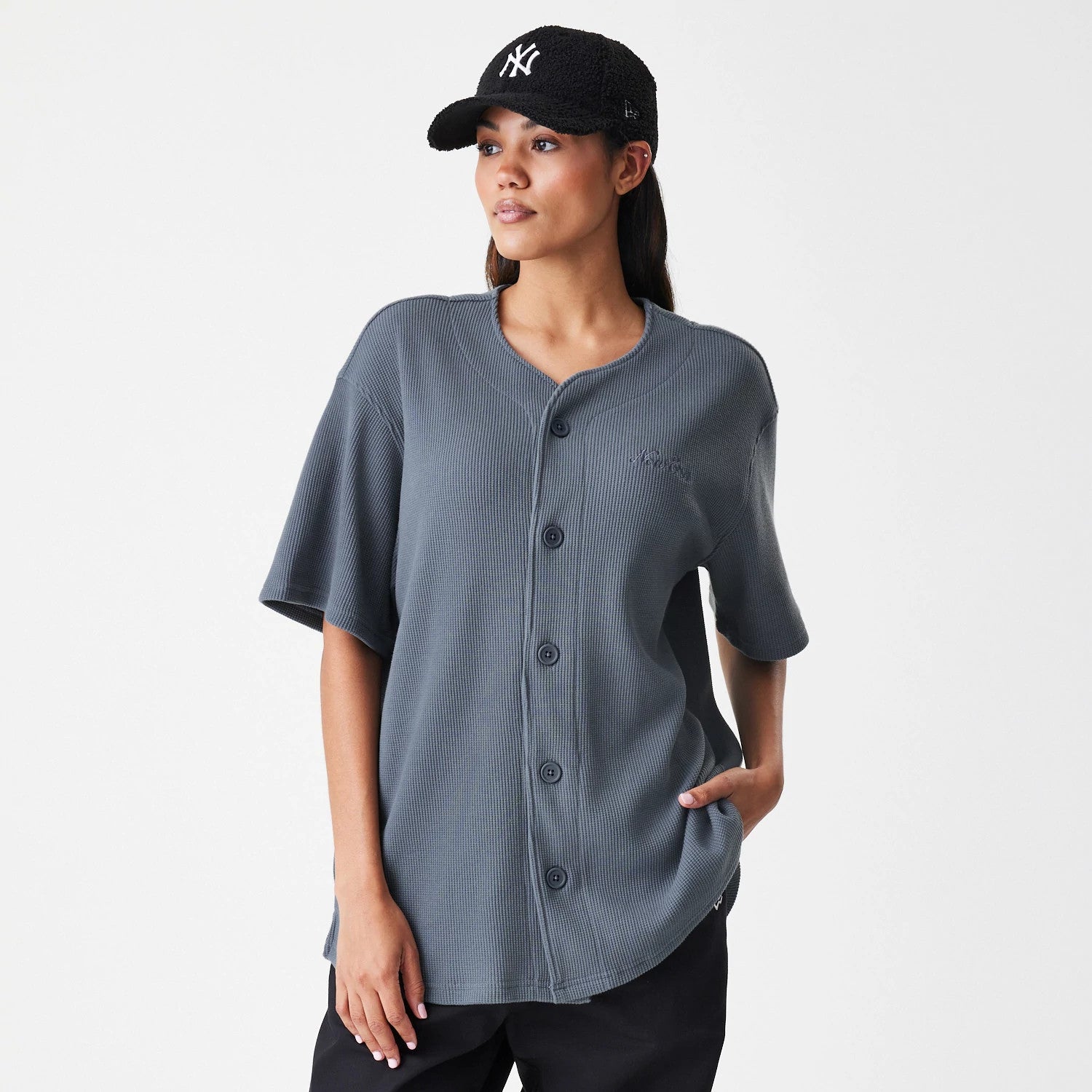The Male model is wearing  New Era Waffle Dark Grey Jersey 4