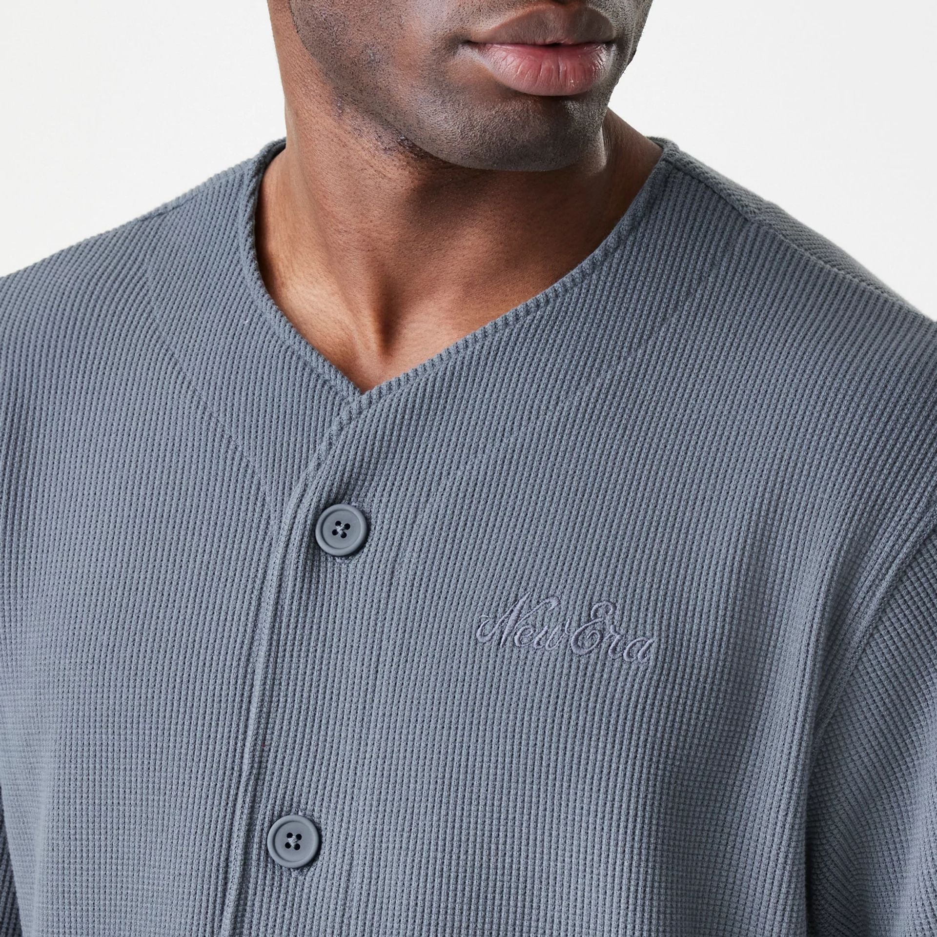 The Male model is wearing  New Era Waffle Dark Grey Jersey  6