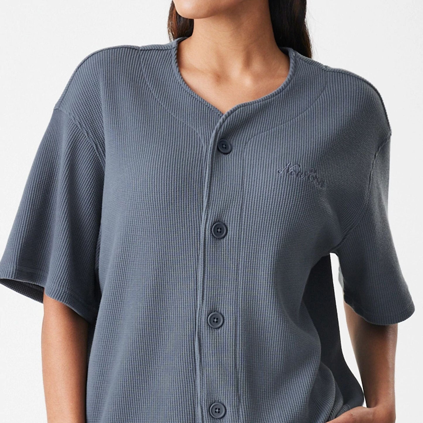 The Male model is wearing  New Era Waffle Dark Grey Jersey  7