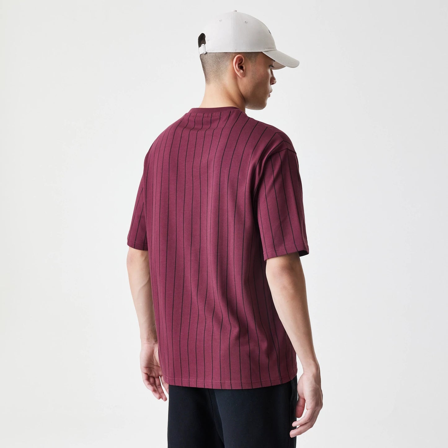 The Male model is wearing  New Era Pinstripe Dark Red Oversized T-Shirt 2