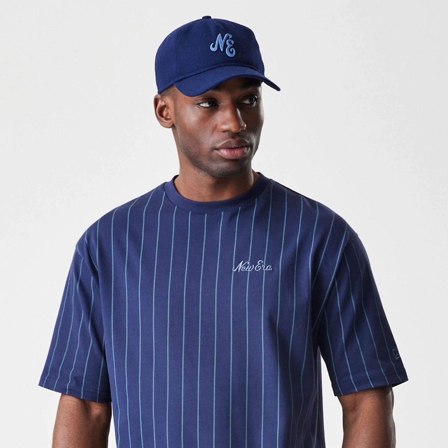 The Male model is wearing  New Era Pinstripe Navy Oversized T-Shirt  6