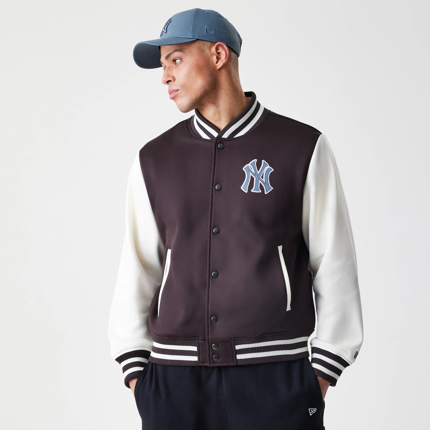 The Male model is wearing New York Yankees MLB Dark Brown Varsity Jacket 3