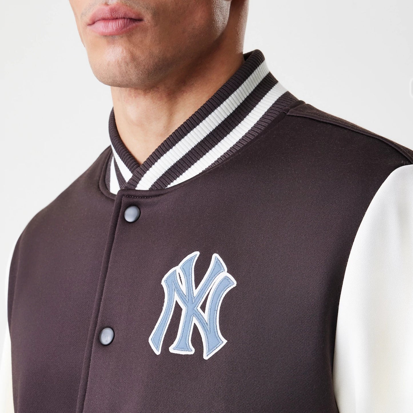 The Male model is wearing New York Yankees MLB Dark Brown Varsity Jacket 5