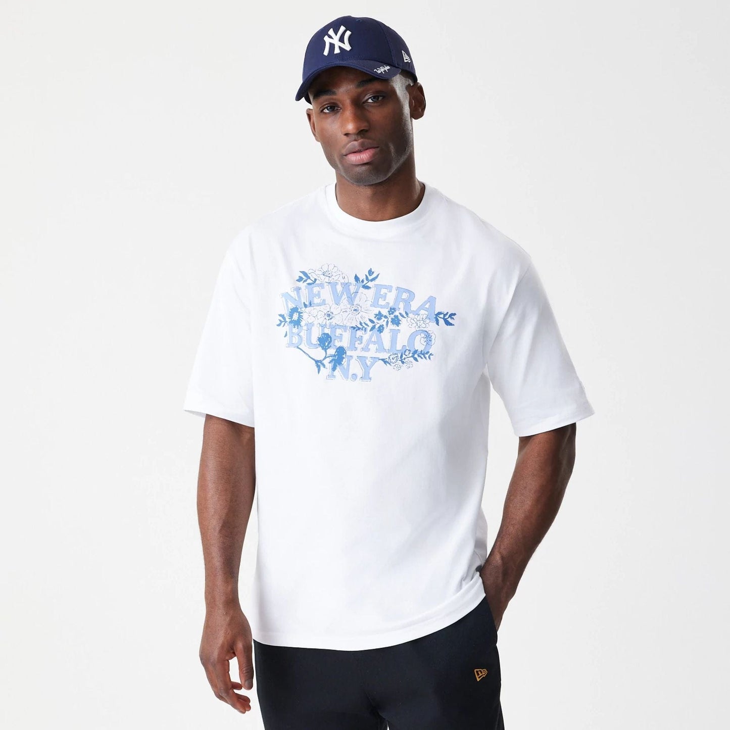 The Male model is wearing  New Era Floral White Oversized T-Shirt  3