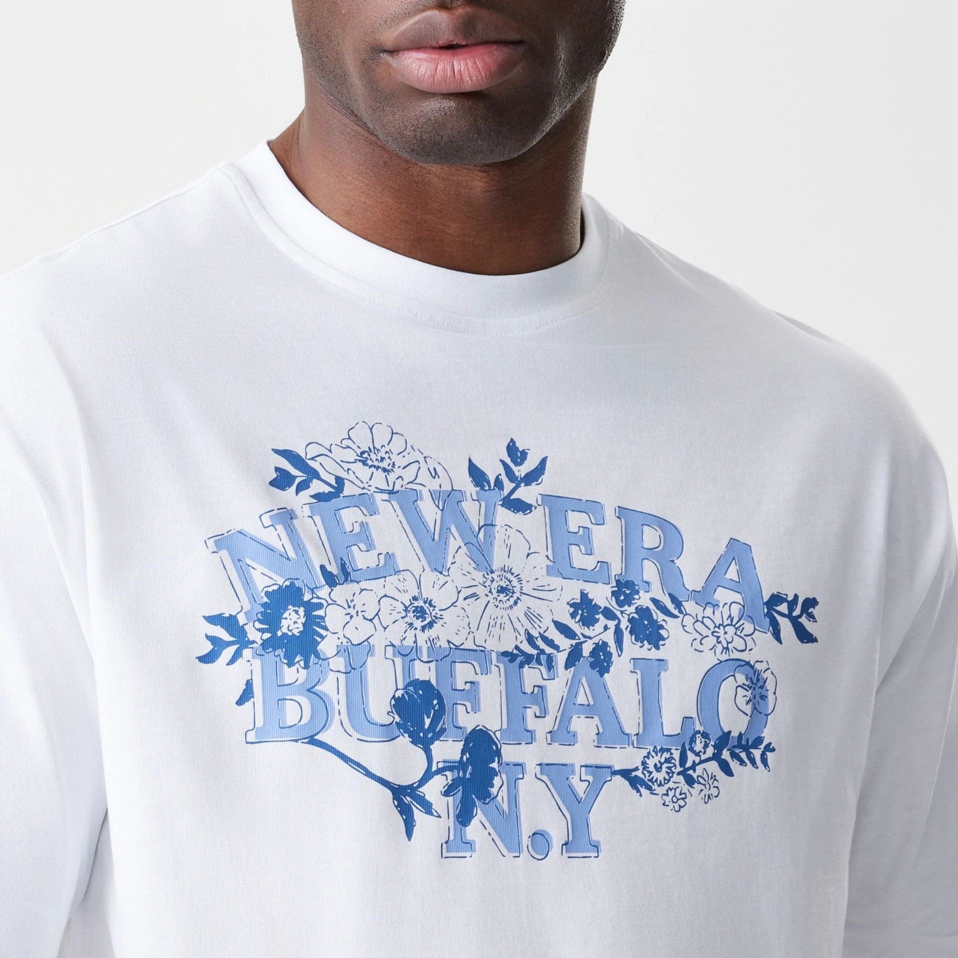 The Male model is wearing  New Era Floral White Oversized T-Shirt  5