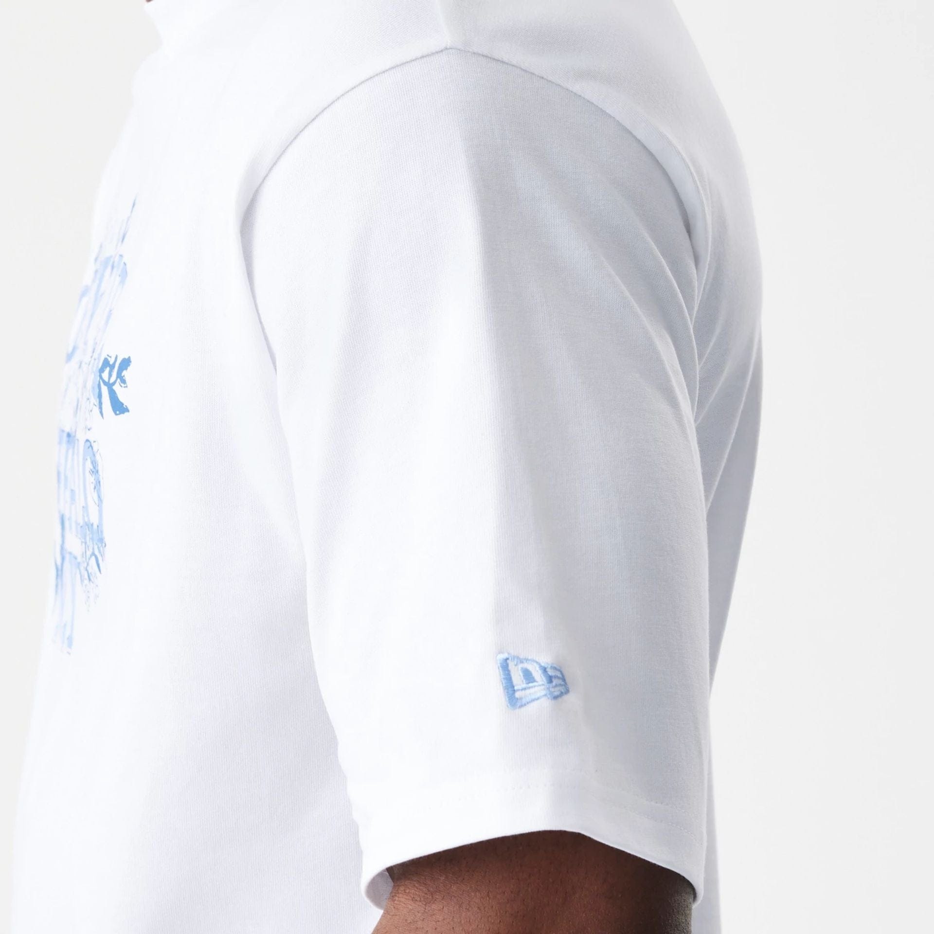 The Male model is wearing  New Era Floral White Oversized T-Shirt  7