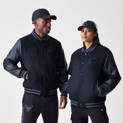 The Male model is wearing Chicago Bulls NBA Tonal Black Varsity Jacket  1