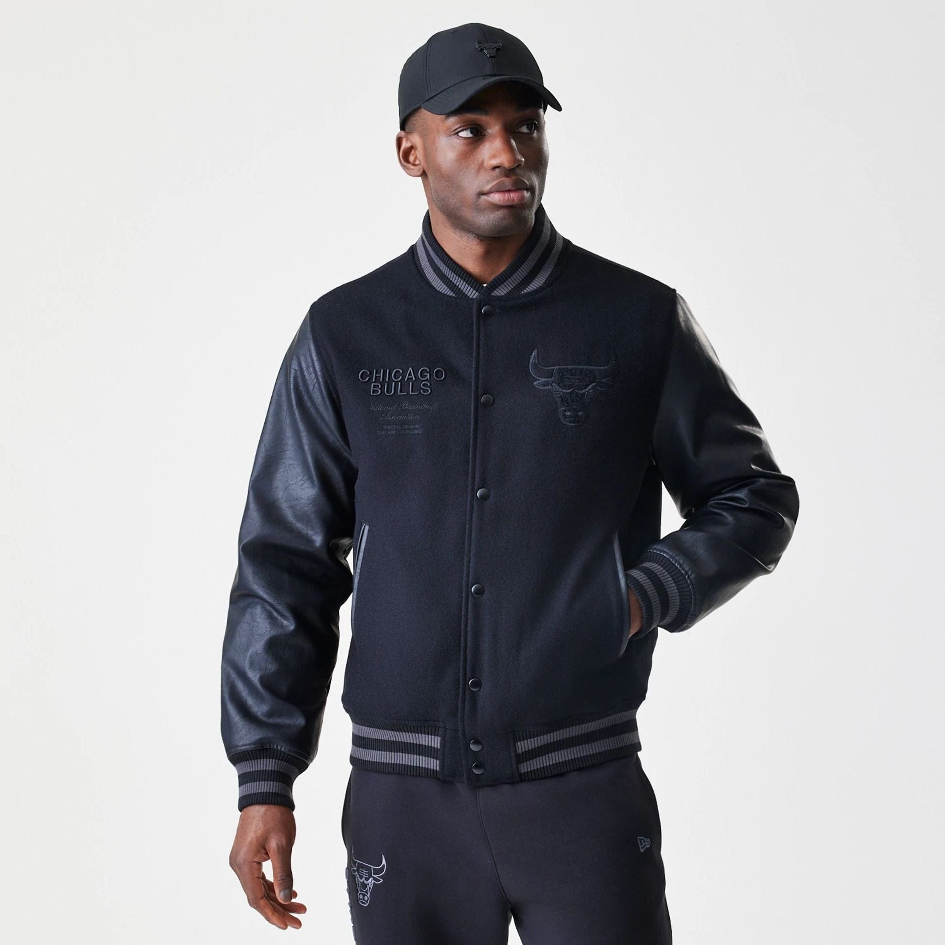 The Male model is wearing Chicago Bulls NBA Tonal Black Varsity Jacket  3
