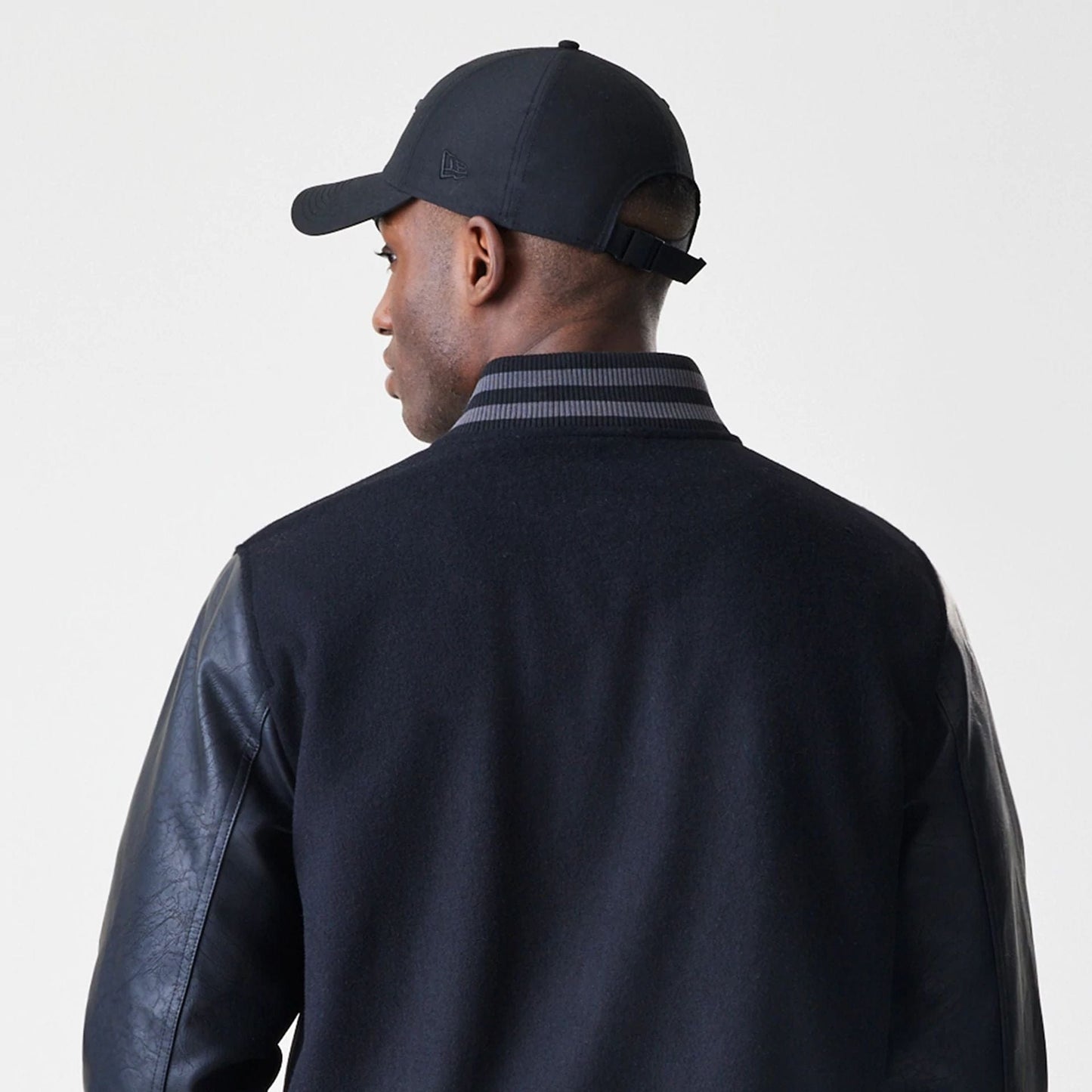 The Male model is wearing Chicago Bulls NBA Tonal Black Varsity Jacket  6