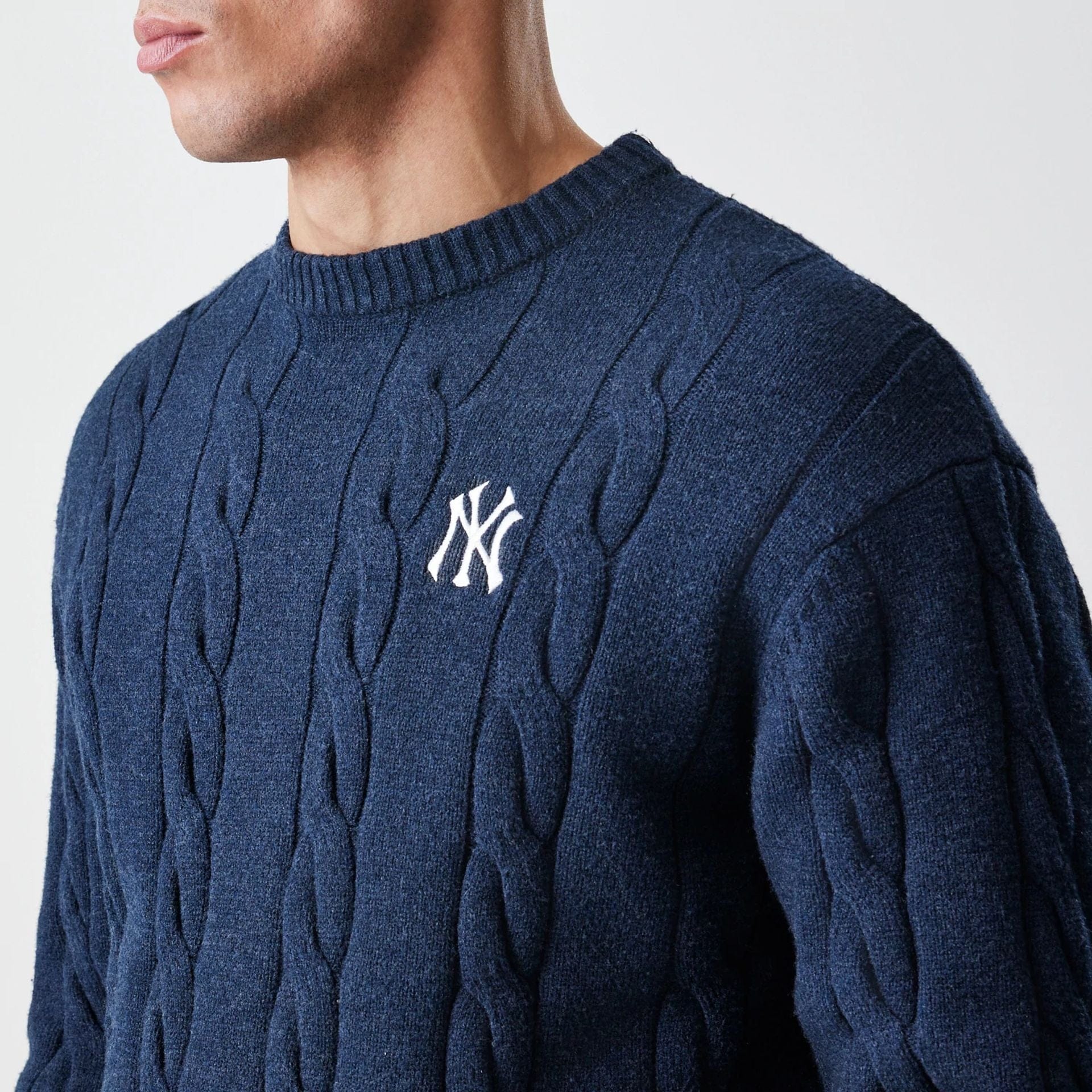 The Male model is wearing New York Yankees MLB Cable Knit Navy Knitted Sweater 4