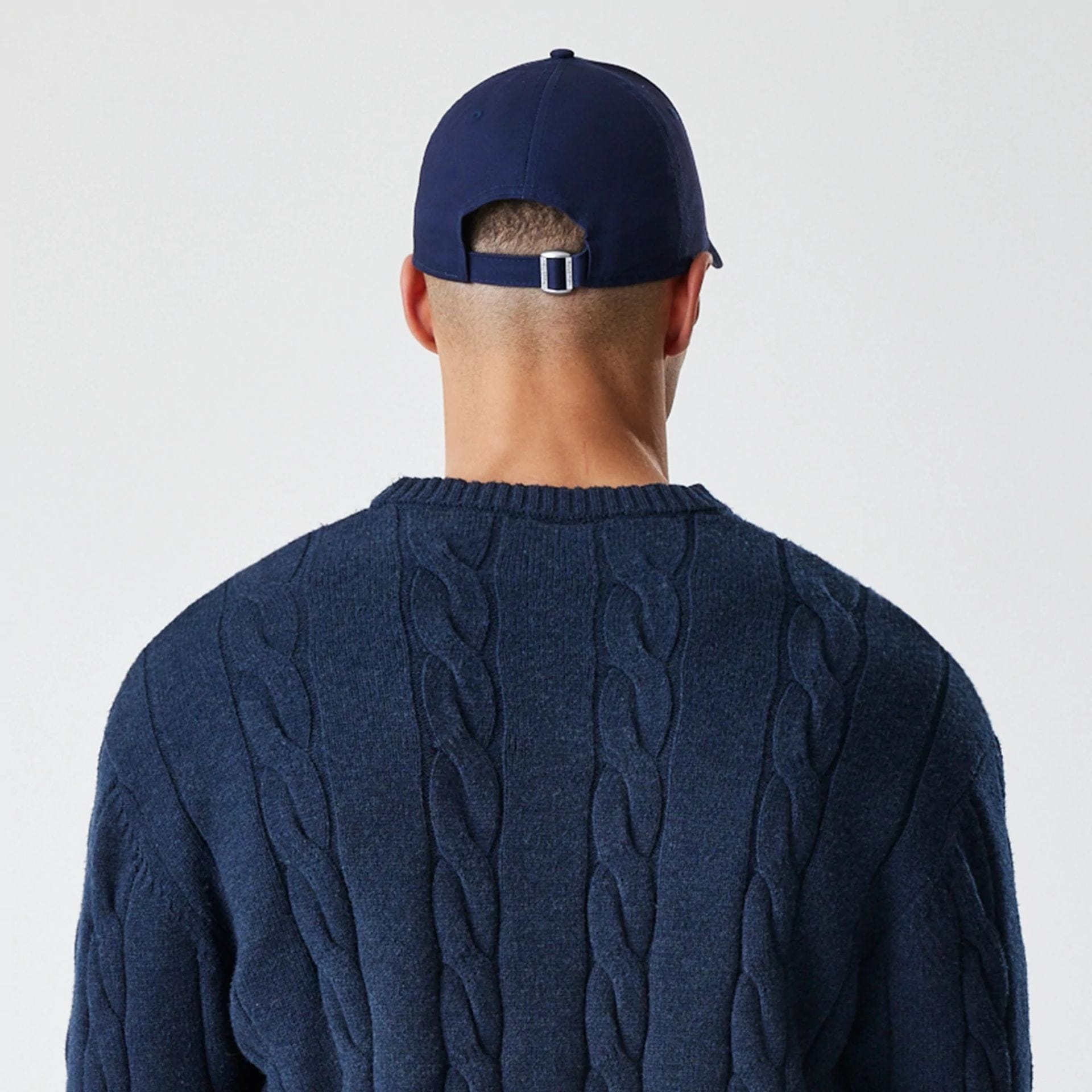 The Male model is wearing New York Yankees MLB Cable Knit Navy Knitted Sweater 7