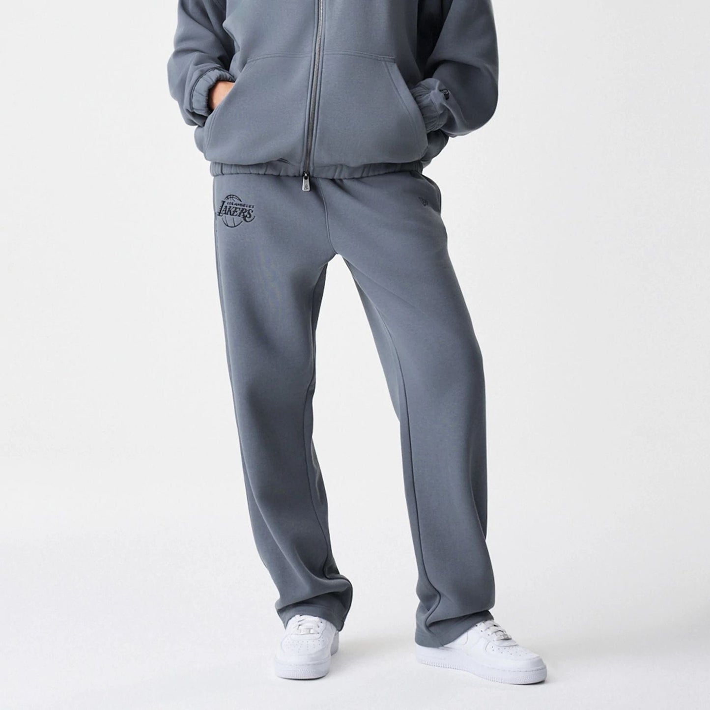 The Male model is wearing LA Lakers NBA Linear Dark Grey Straight Leg Joggers  6
