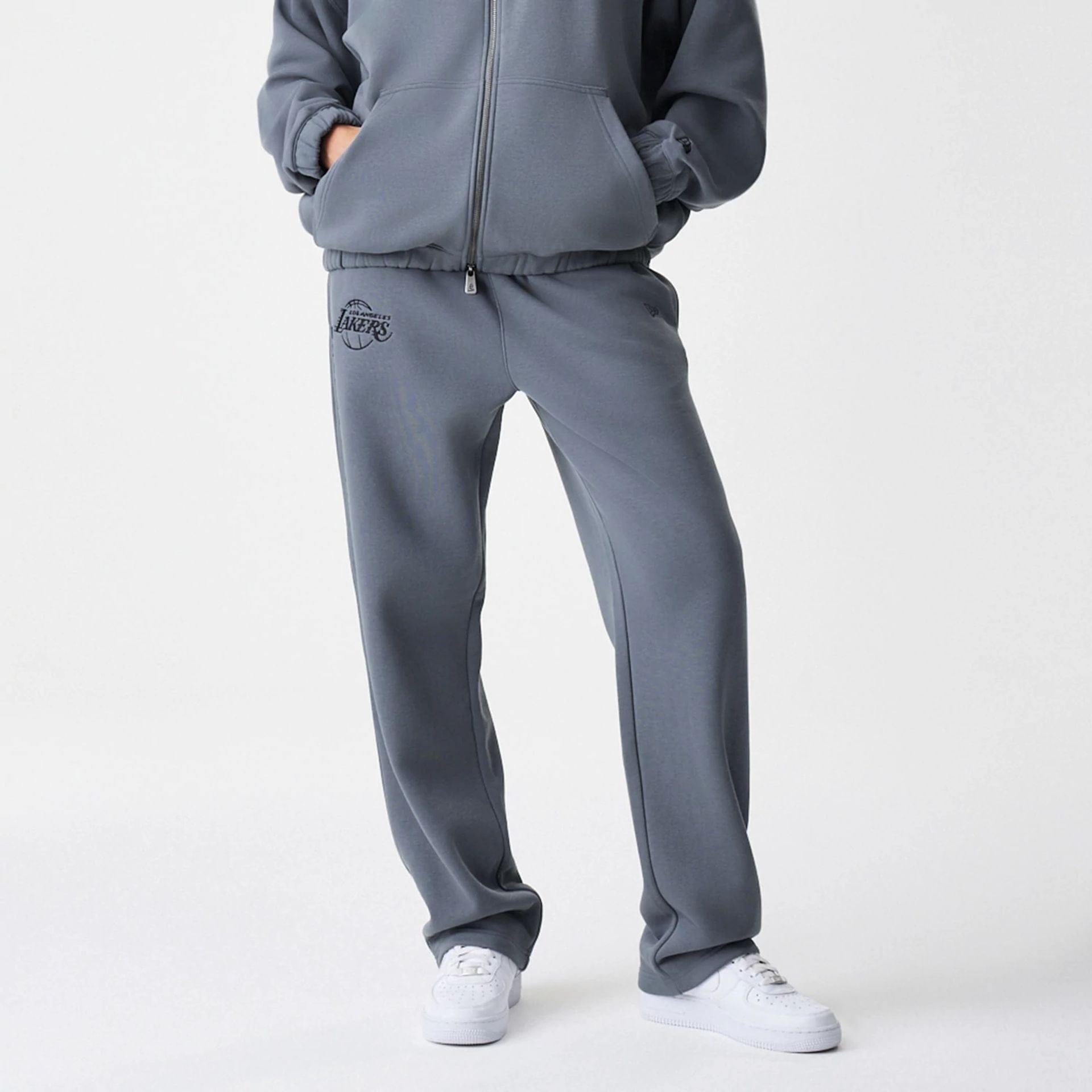 The Male model is wearing LA Lakers NBA Linear Dark Grey Straight Leg Joggers  6
