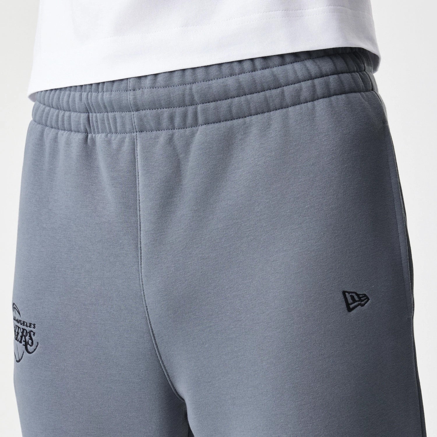 The Male model is wearing LA Lakers NBA Linear Dark Grey Straight Leg Joggers 4