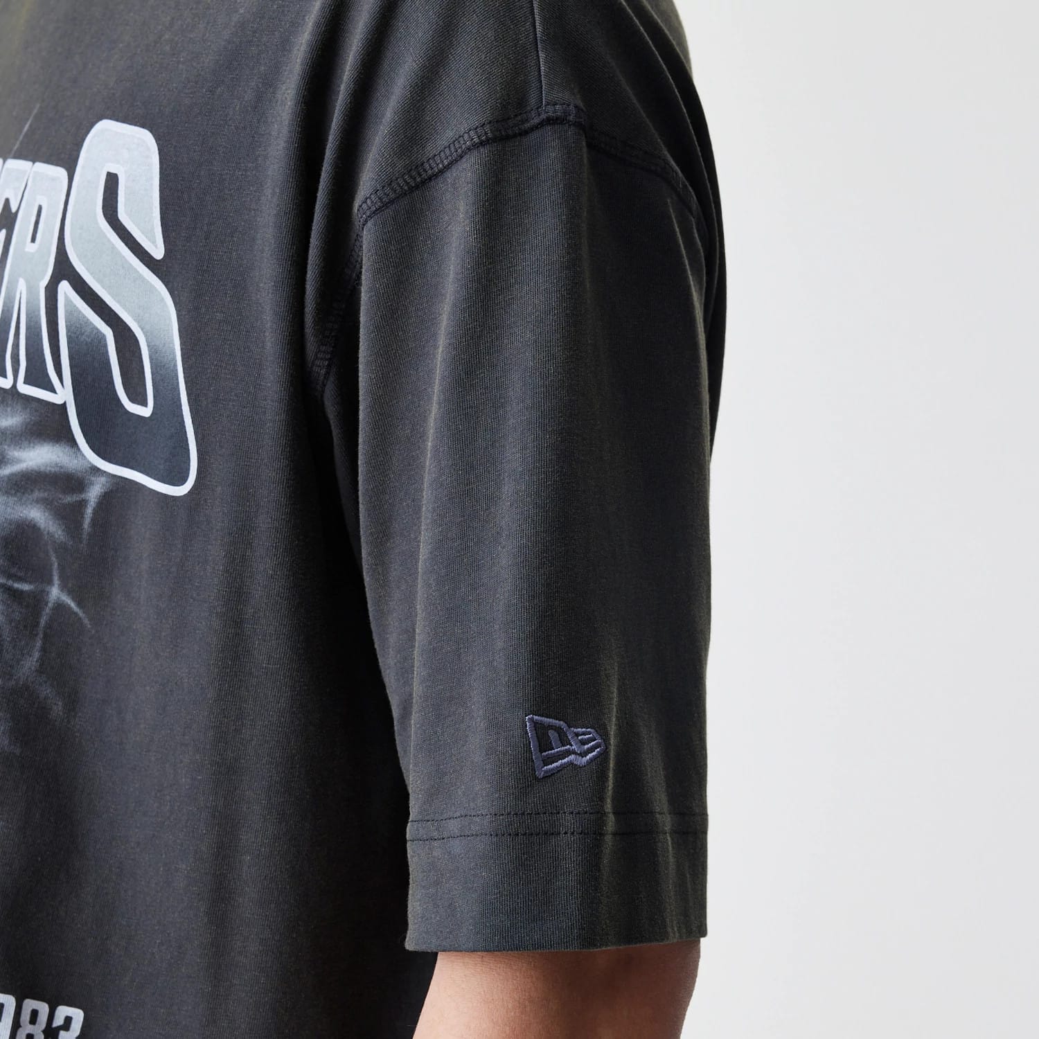 The Male model is wearing Las Vegas Raiders NFL Washed Boxy Dark Grey Oversized T-Shirt 5