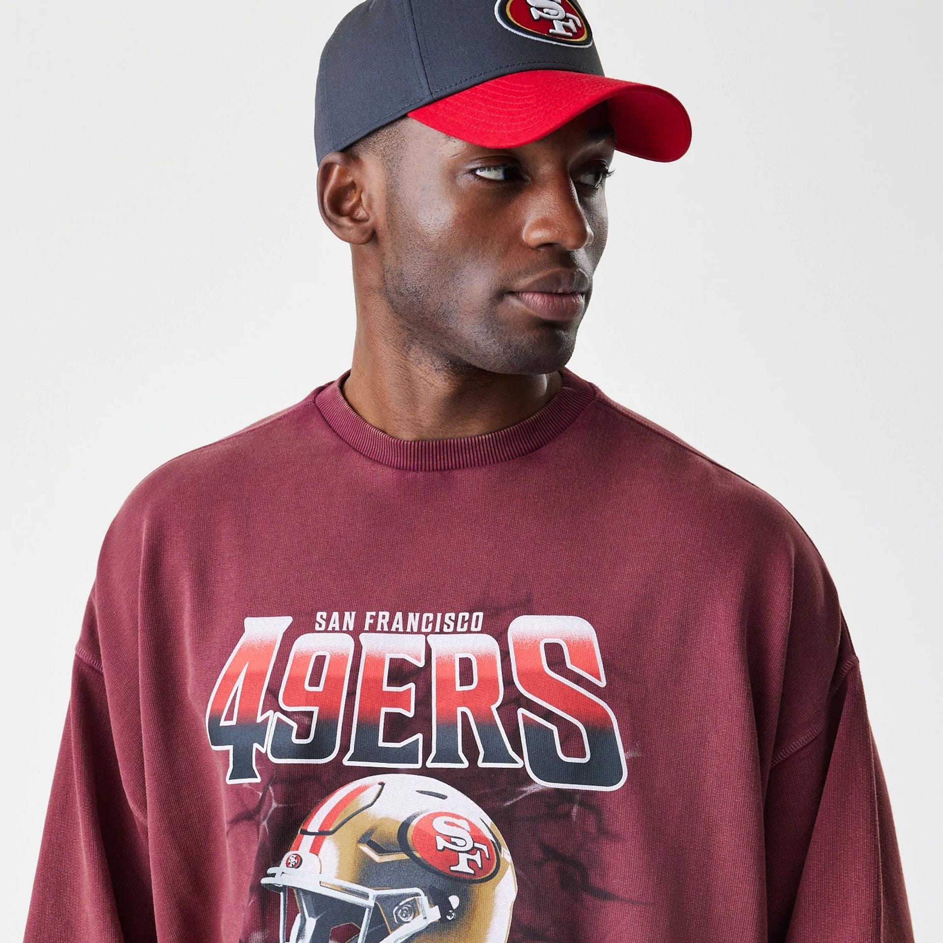 The Male model is wearing San Francisco 49ers NFL Washed Boxy Dark Red Oversized Crew Neck Sweater 6