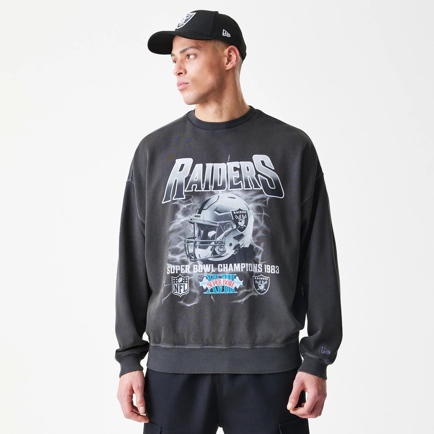 The Male model is wearing Las Vegas Raiders NFL Washed Boxy Dark Grey Oversized Crew Neck Sweater 3
