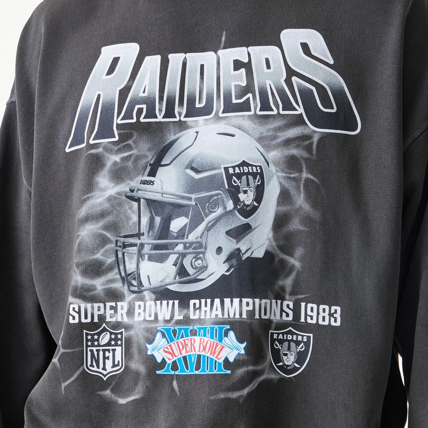 The Male model is wearing Las Vegas Raiders NFL Washed Boxy Dark Grey Oversized Crew Neck Sweater 5