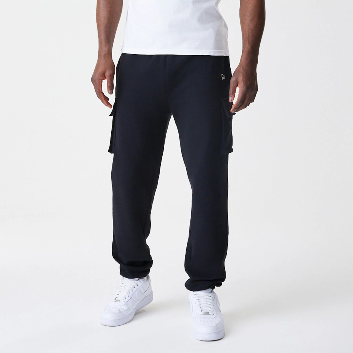 The Male model is wearing  New Era Cargo Black Joggers 3