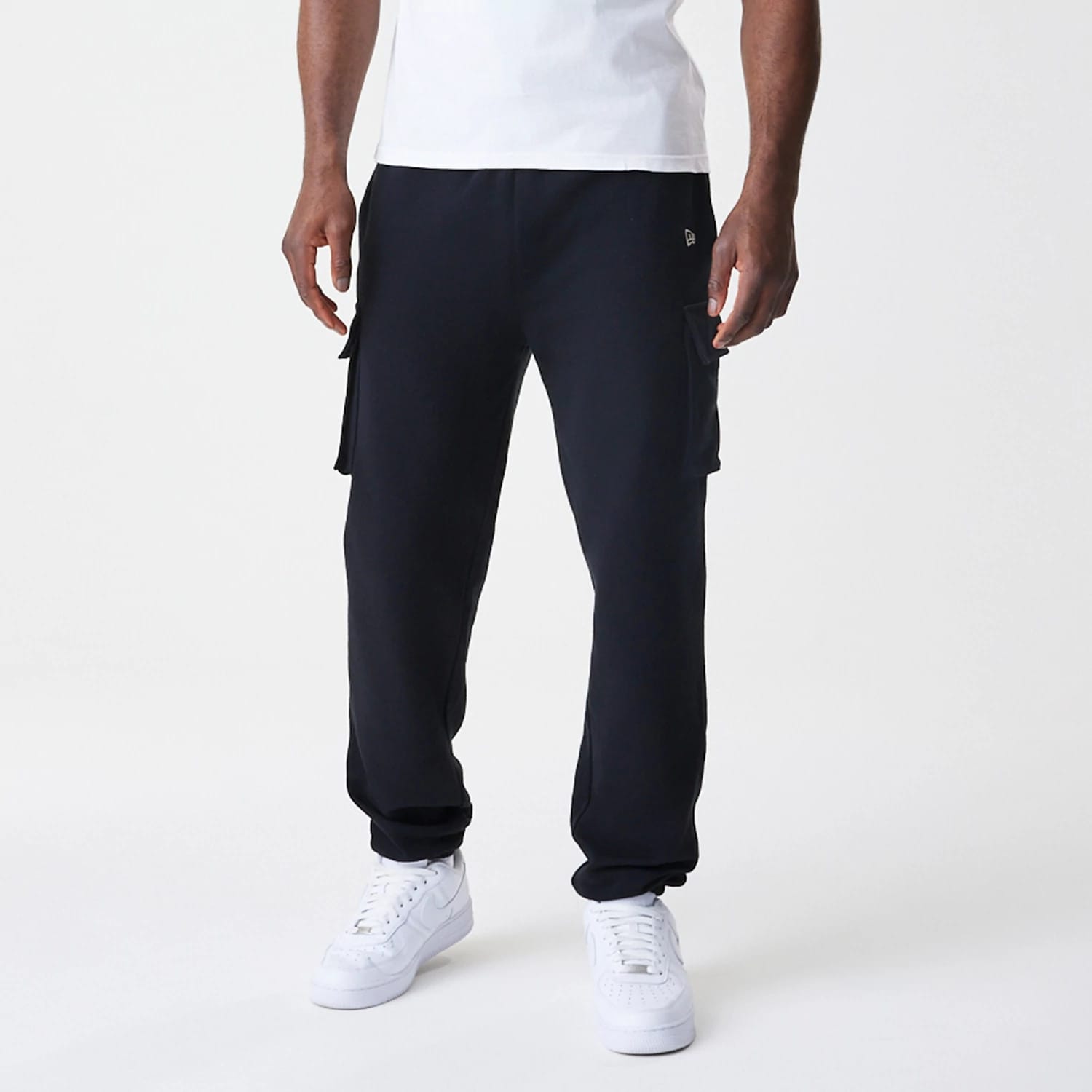 The Male model is wearing  New Era Cargo Black Joggers 3