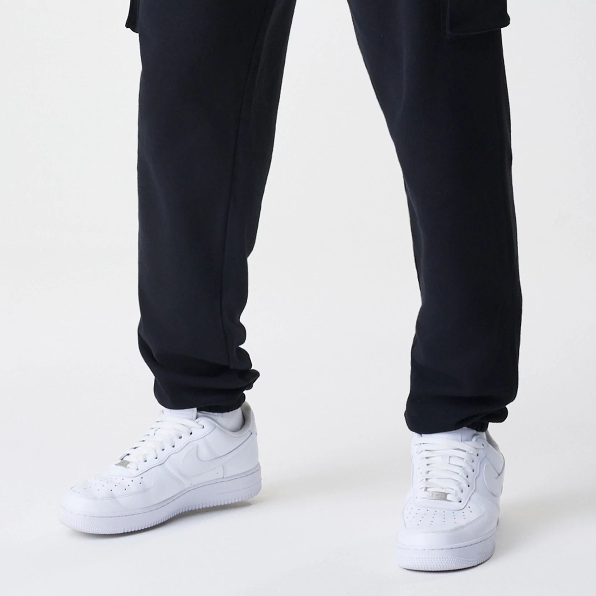 The Male model is wearing  New Era Cargo Black Joggers  5