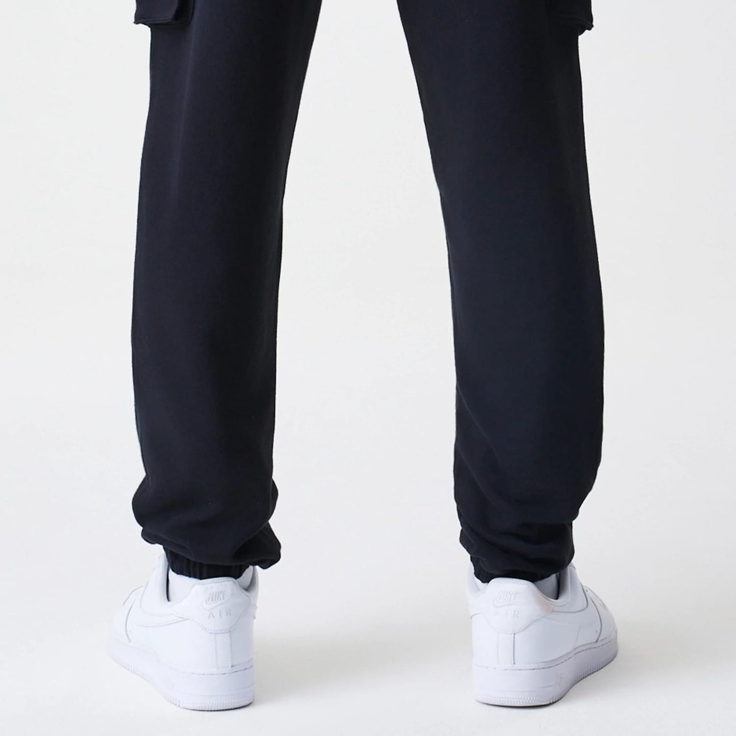 The Male model is wearing  New Era Cargo Black Joggers 7