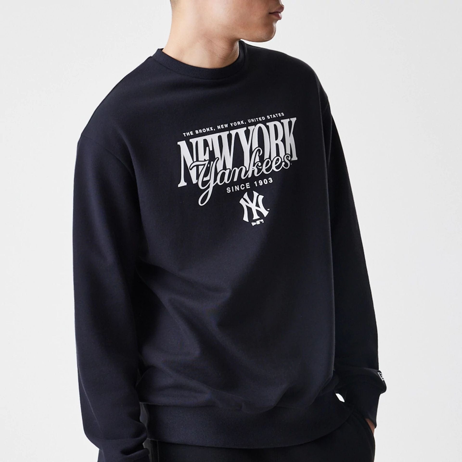 The Male model is wearing New York Yankees MLB Script Black Crew Neck Sweater  3