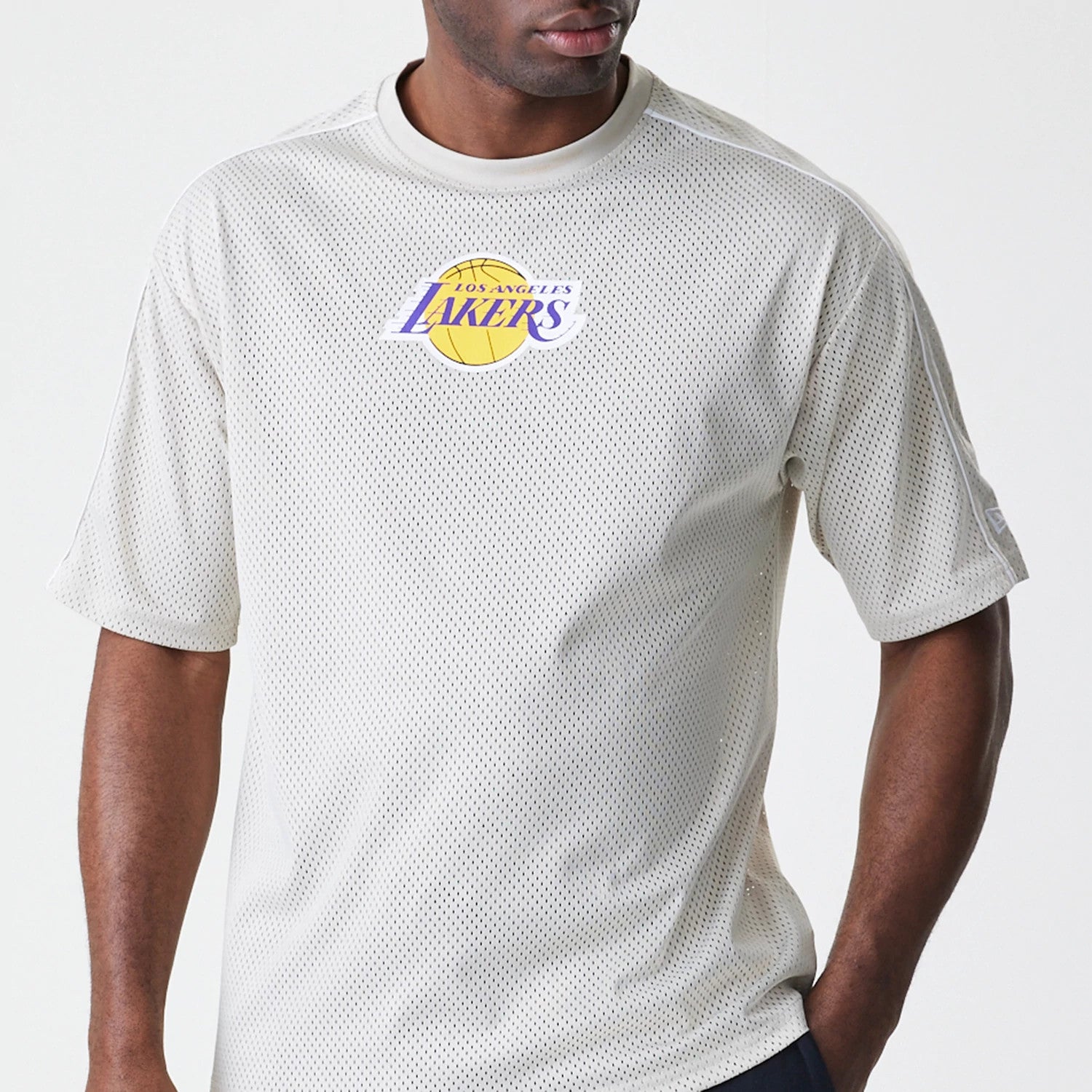 The Male model is wearing LA Lakers NBA Piping Light Beige Oversized Mesh T-Shirt 3