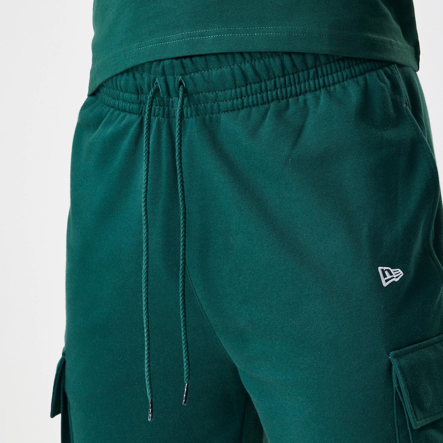 The Male model is wearing  New Era Core Cargo Dark Green Joggers 5